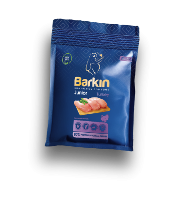 Busta di croccantini per cuccioli Barkin Junior Turkey, confezione blu scuro con accenti viola.