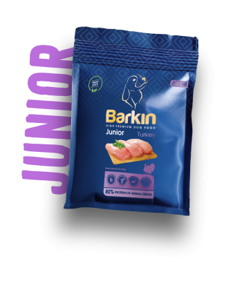 Busta di croccantini per cuccioli Barkin Junior Turkey, confezione blu scuro con accenti viola.